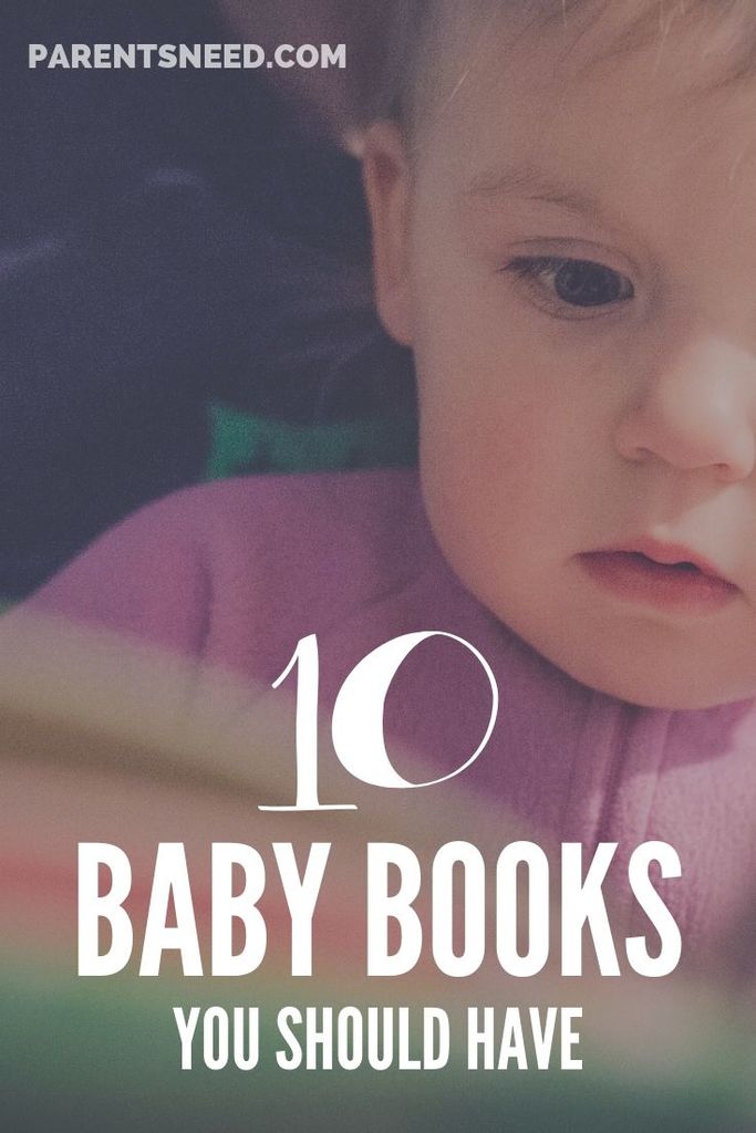 Baby mesmerized by a book.