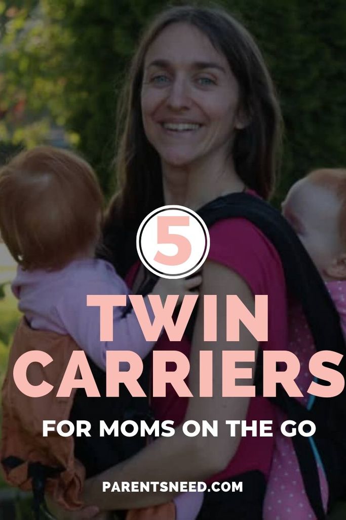 Mother carrying her twins on her front and back