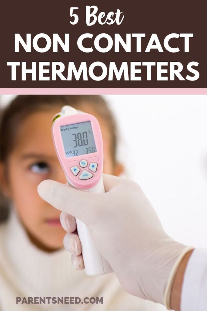 A child getting her temperature taken with a non-contact thermometer