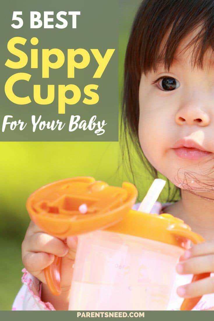 A cute toddler holding a sippy cup